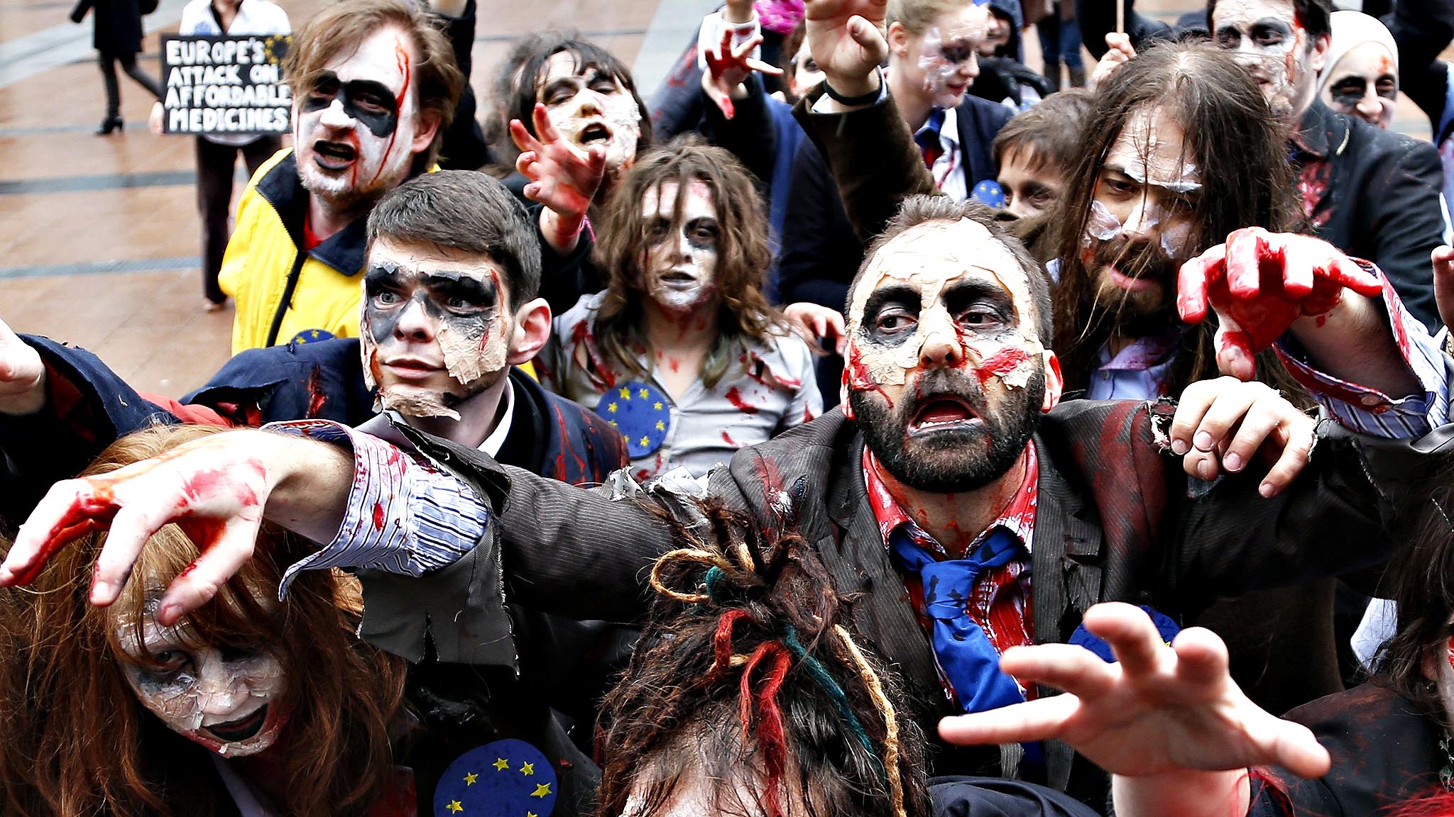 Demonstrators, including members of the European Parliament, dre